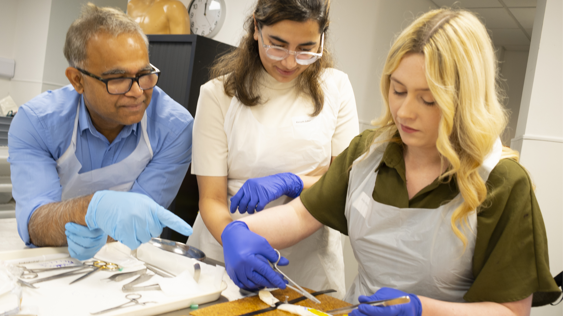 people participating in essential surgical skills course
